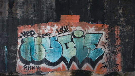 a wall that has some graffiti on it