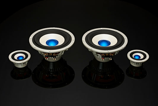 a pair of speakers sitting on top of a table