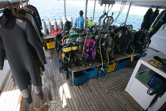 a bunch of scuba gear on a boat