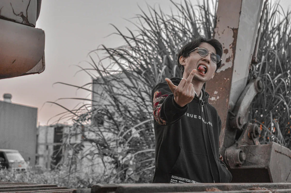 a man making a silly face with his fingers