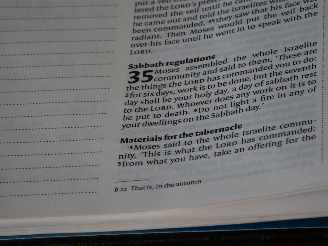 Close-up of an open bible with text visible